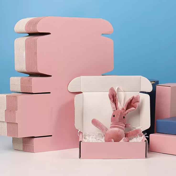 Op maat bedrukt kleurenlogo golfkarton cosmetische verzending roze mailer papieren doos kledingverpakkingsdoos
