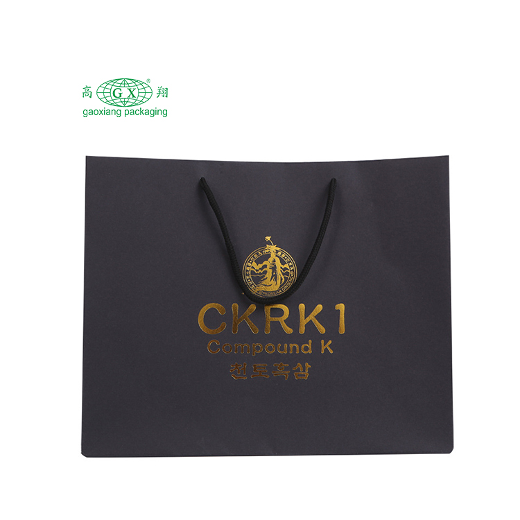 Eco-vriendelijke, op maat gemaakte logo-cadeauzakjes, mat gelamineerde boutique private label, elegante papieren zak met gouden lint